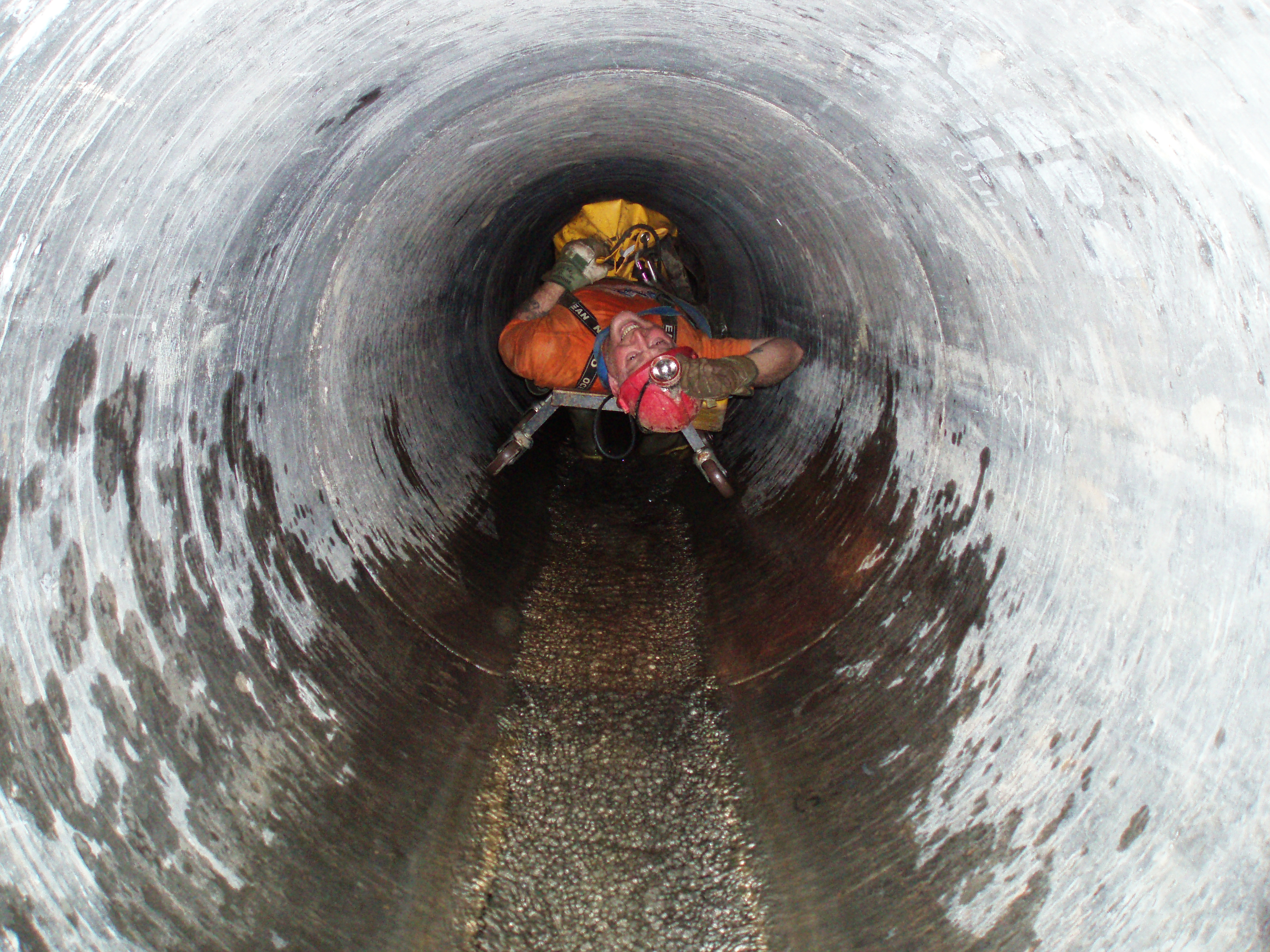 Dave Flowers on a trolley in the concrete lining pipe